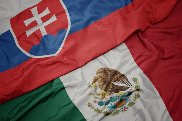 Waving colorful flag of mexico and national flag of slovakia. macro — Stock Photo, Image