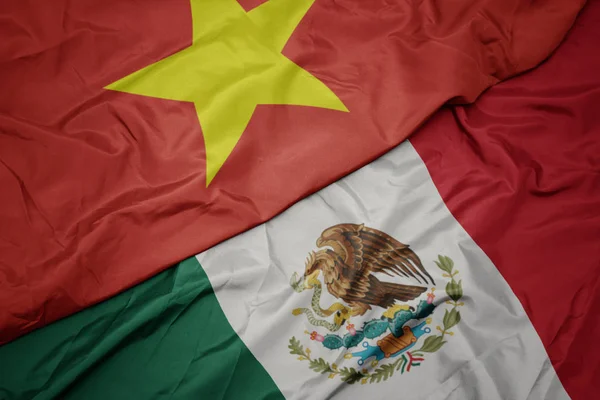 멕시코의 화려 한 깃발 과 베트남의 국기를 흔들었습니다. 매크로 — 스톡 사진