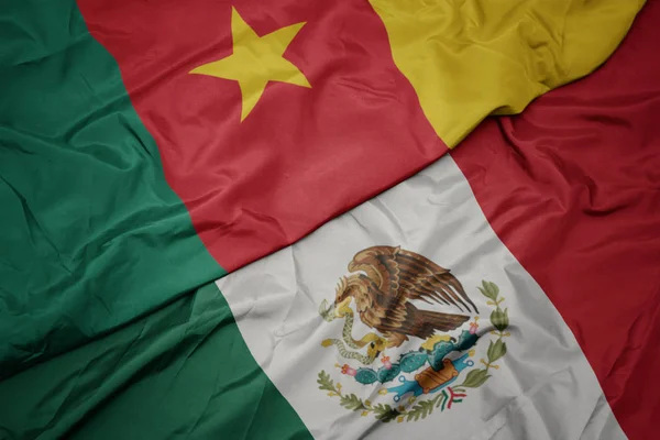 Waving colorful flag of mexico and national flag of cameroon. macro — Stock Photo, Image