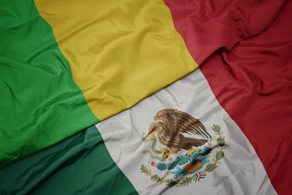 Waving colorful flag of mexico and national flag of mali. macro — Stock Photo, Image