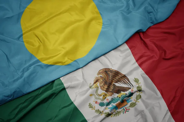 Waving colorful flag of mexico and national flag of Palau . macro — ストック写真