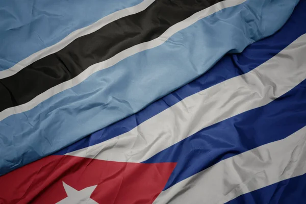 Waving colorful flag of cuba and national flag of botswana. — Stock Photo, Image