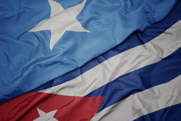 Waving colorful flag of cuba and national flag of somalia. — Stock Photo, Image