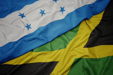 Jamaika 'nın renkli bayrağı ve Honduras' ın ulusal bayrağı sallanıyor.