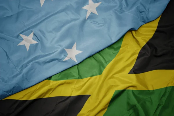 Ondeando colorida bandera de jamaica y bandera nacional de Estados Federados de Micronesia  . —  Fotos de Stock