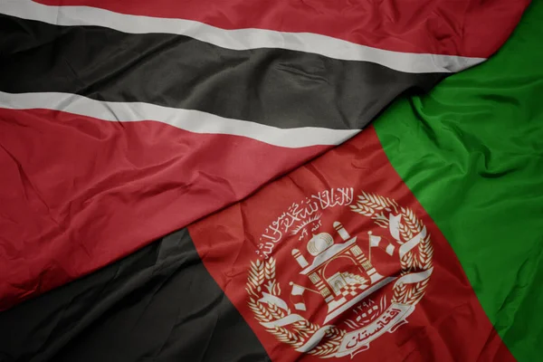 Machanie Kolorową Flagą Afganistanu Flagą Narodową Trynidadu Tobago — Zdjęcie stockowe