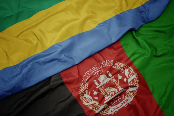 Machanie Kolorową Flagą Afganistanu Flagą Narodową Gabonu — Zdjęcie stockowe