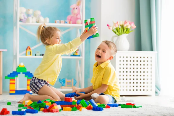 Boy with a girl playing at home — Stock Photo, Image