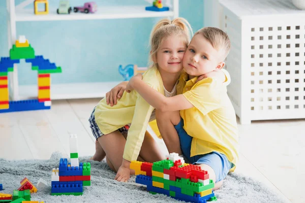 Boy with a girl playing at home — Stock Photo, Image