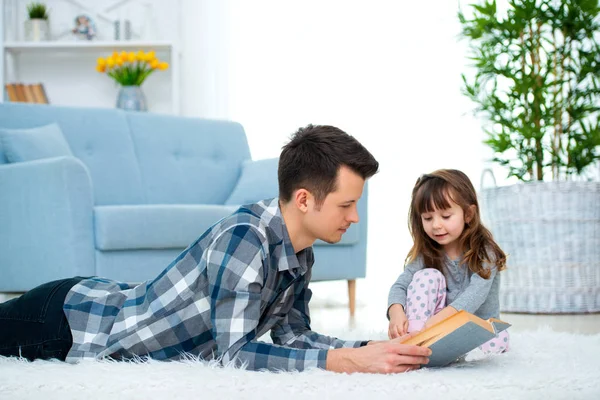Cute Little Girl Listening Dad Reading Fairy Tale Lying Warm — 图库照片
