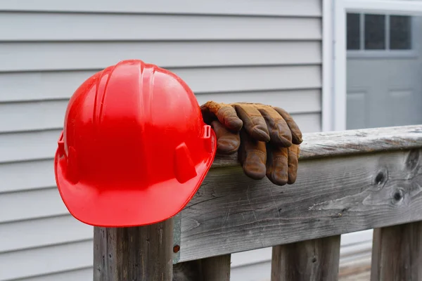 Red Hard Hat And Work Gloves