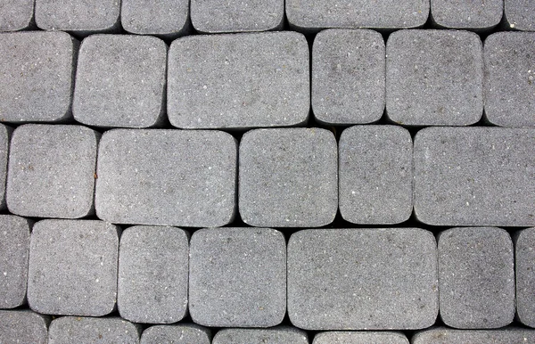 深灰色铺路工用不同尺寸新石头的背景 — 图库照片