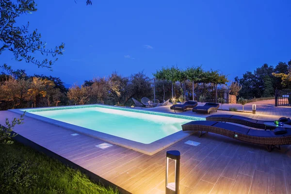 holiday home with swimming pool at night