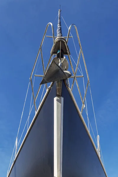 bow and mast on sailing boat, front view