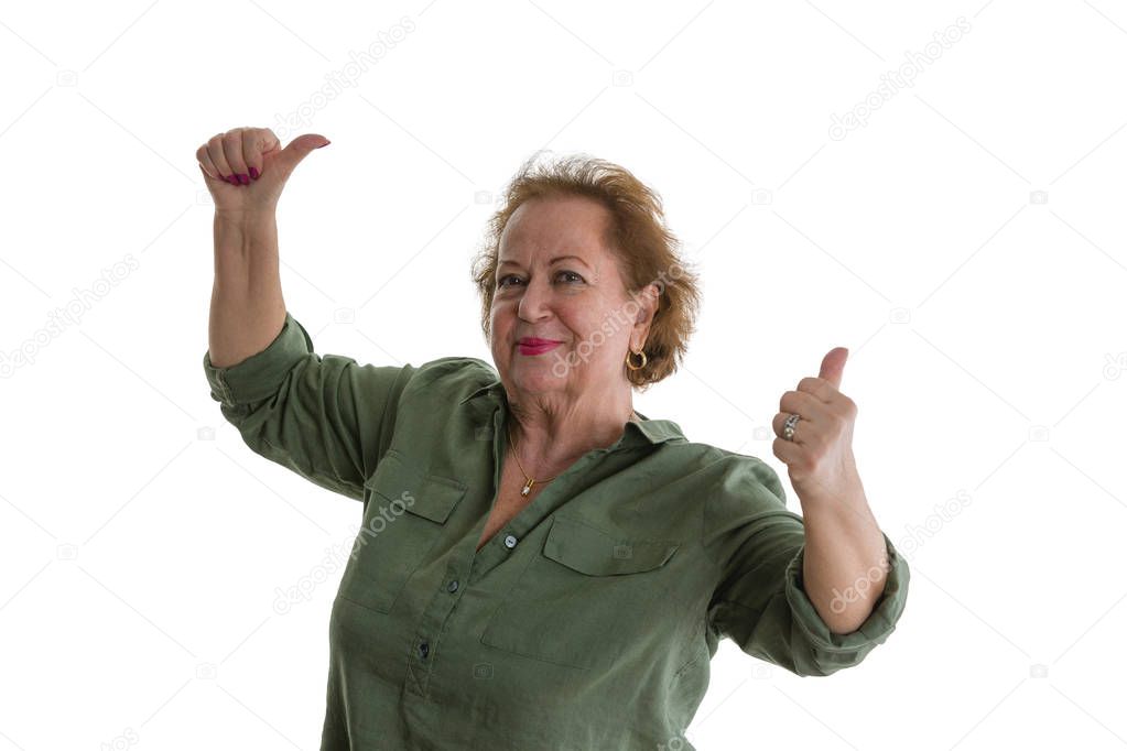 Portrait of happy senior lady giving thumbs up against white background