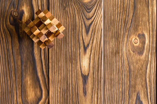 Skomplikowane Interlocked Drewniane Puzzle Rogu Teksturowanej Tło Drewna Miejsca Rysunek — Zdjęcie stockowe