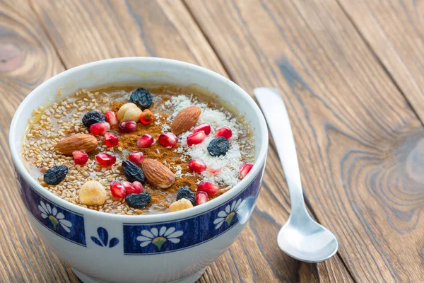 Small Asure Bowl Tasty Cereal Nuts Fruit Next Small Spoon — Stock Photo, Image