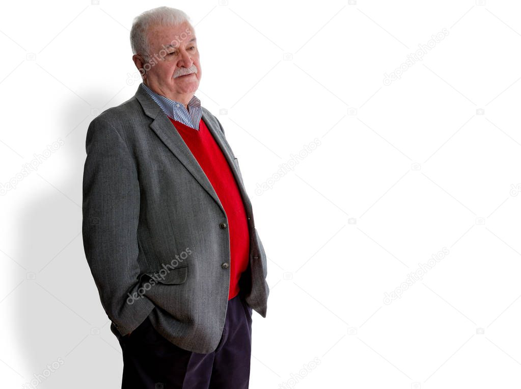 Forgetful elderly man standing thinking trying to remember something or confused due to senility or Alzheimers disease over white with copy space