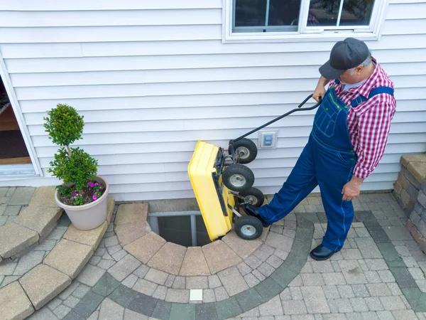 Man Performing Maintenance Neglected Egress Window Basement His House Emptying — Stock Photo, Image