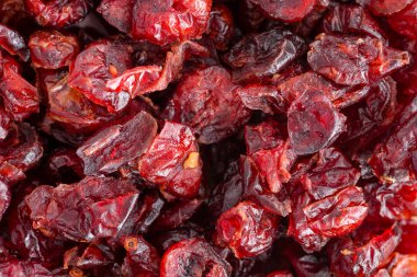 Ayrıntılı olarak kurutulmuş cranberries C vitamini ve diyet lif açısından zengin sağlıklı bir tam kare arka plan doku makro görünümü kapatın