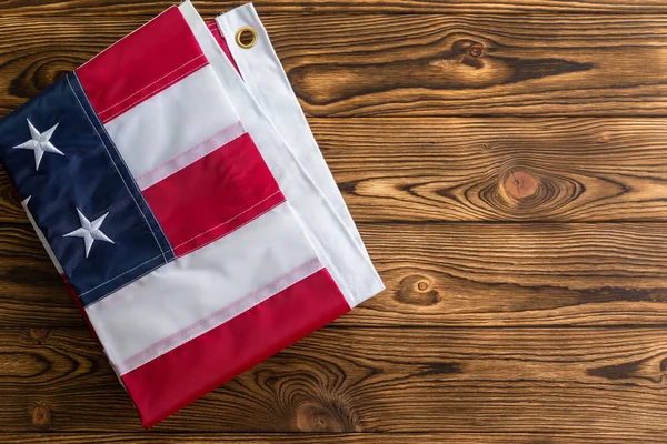 Neatly Folded Patriotic American Flag Showing Stars Stripes Rustic Wood — Stock Photo, Image