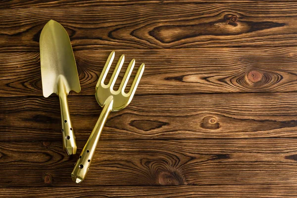 Conceptual View Golden Color Garden Tools Rustic Wooden Garden Table — Stock Photo, Image