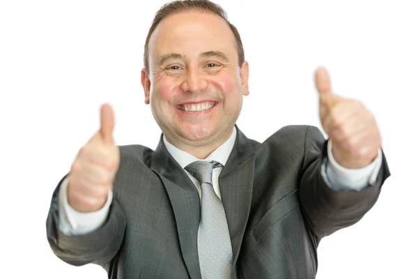 Excited mature businessman giving thumbs up signal — Stock Photo, Image