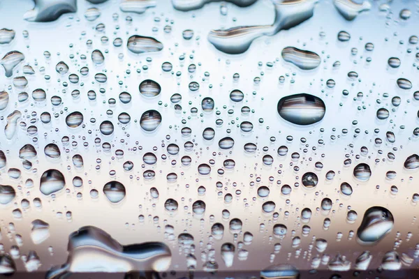 Water on phone screen. A background from drops on glass — Stock Photo, Image