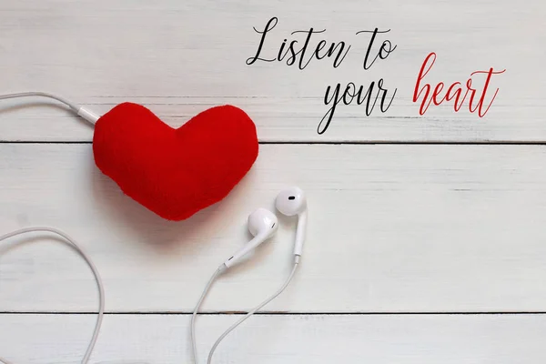 Listen to your heart card. Red heart with earphones