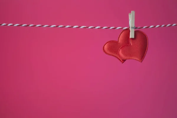 Two Red Hearts Clothespin Purple Background — Stock Photo, Image