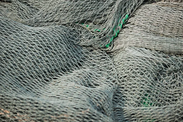 Fishing net close-up texture background grey and green pattern