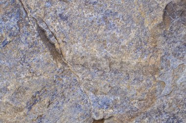 taş doku dokulu arka plan, kayalık, çukurlar, çarpmak, inşaat; kaba; çini; kum; tuval; Yapı; blok; katı; düzeyi; Çimento; Yaşlı; sarı; parlak