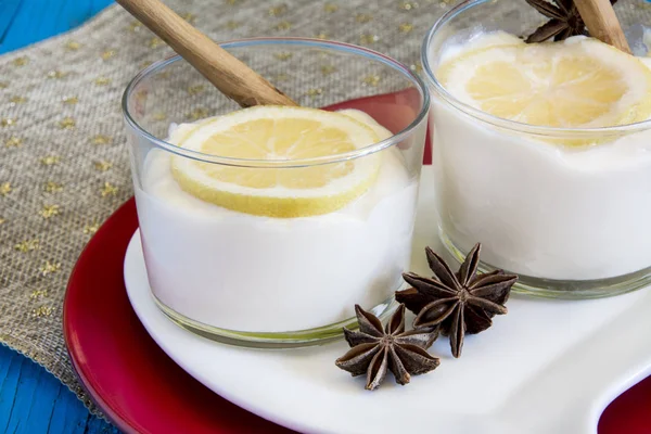 lemon mousse served in glass tumbler.