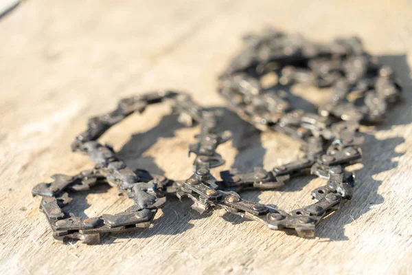 Old chainsaw chain. Place for your text.