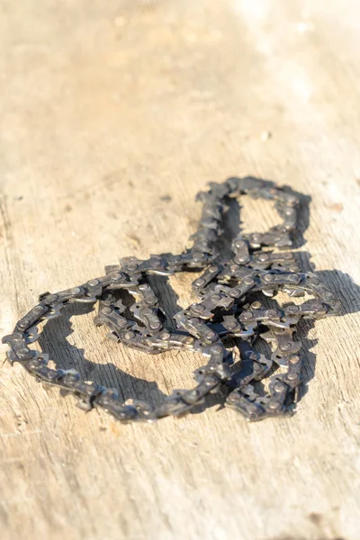 Old chainsaw chain. Place for your text.