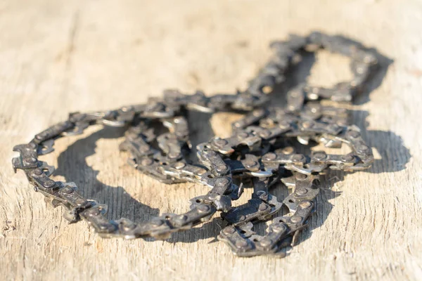 Old chainsaw chain. Place for your text.