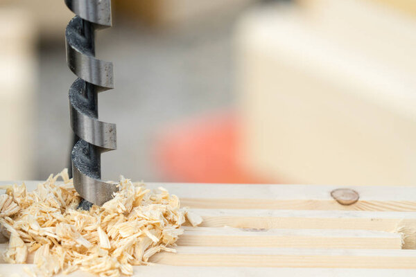 The man drilling the wood. Place for your text..