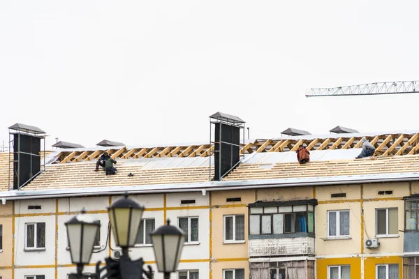 Roof repair in an apartment building. Work at height.