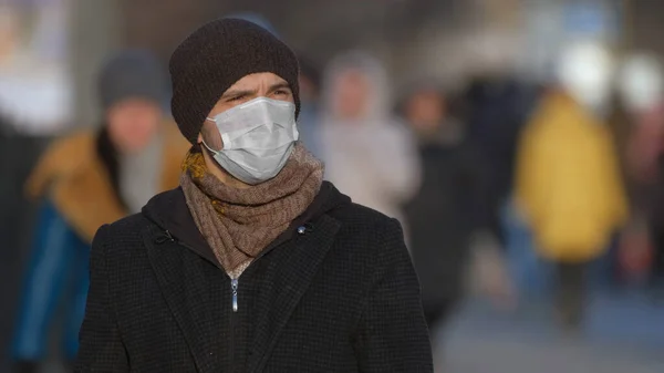 Man in mask coronavirus 2019-ncov. Corona virus covid-19. Environment pollution.