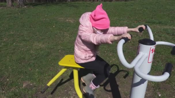 Little Girl Take Fun Training Machine — Stock Video