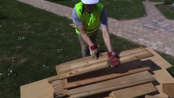 Woman Sorting Planks Outdoor — Stock Video