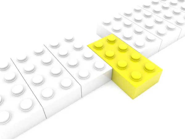 Gelber Spielzeugstein Außer Reihe — Stockfoto