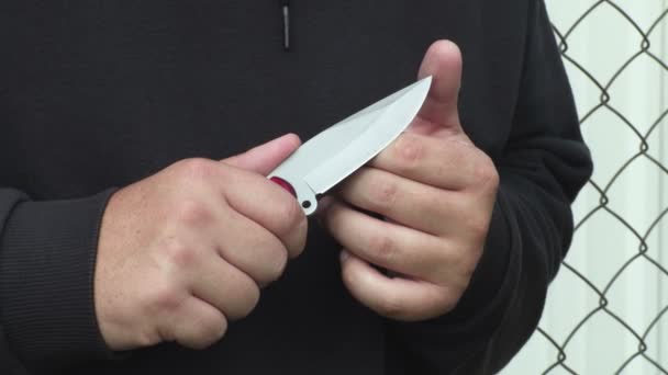 Man Checking Knife Sharpness — Stock Video