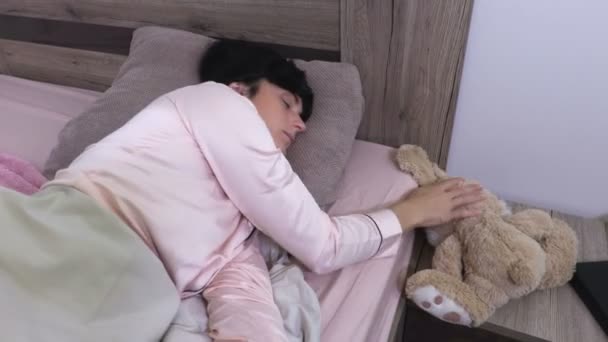 Woman Sleeping Looking Soft Toy — Stock Video