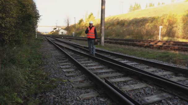 Railway Engineer Walk Railway Rails — Stock Video