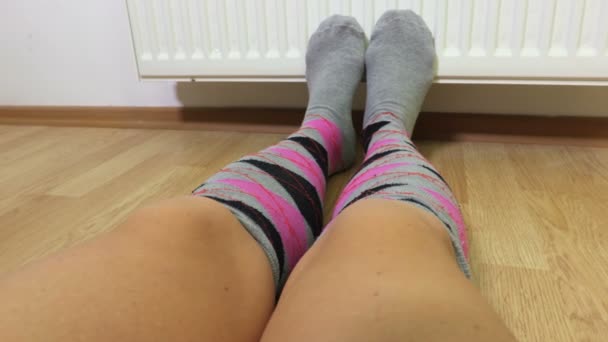 Woman Keeping Cold Feets Front Heating Radiator — Stock Video
