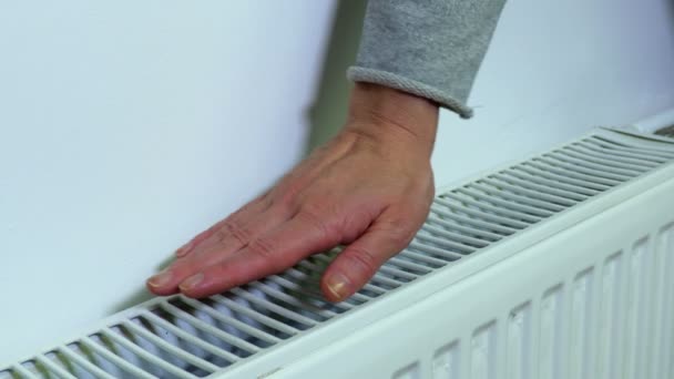 Woman Checking Temperature Heating Radiator — Stock Video