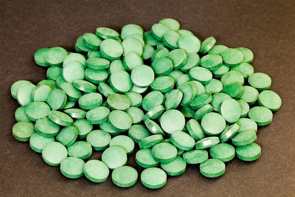 Spirulina green pills.Alternative medicine concept