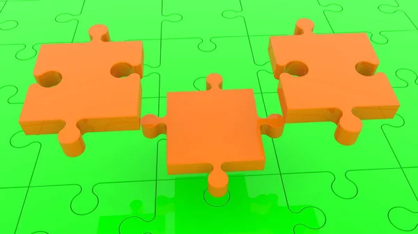 Drei Puzzleteile Orange Auf Grün — Stockfoto