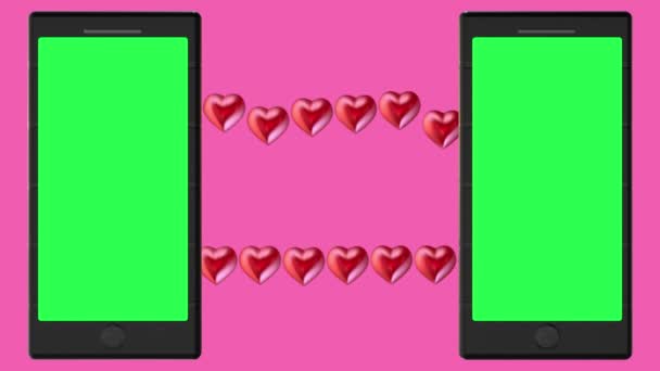 Dva telefony se zelenými obrazovkami a koncept červených srdcí na růžovém